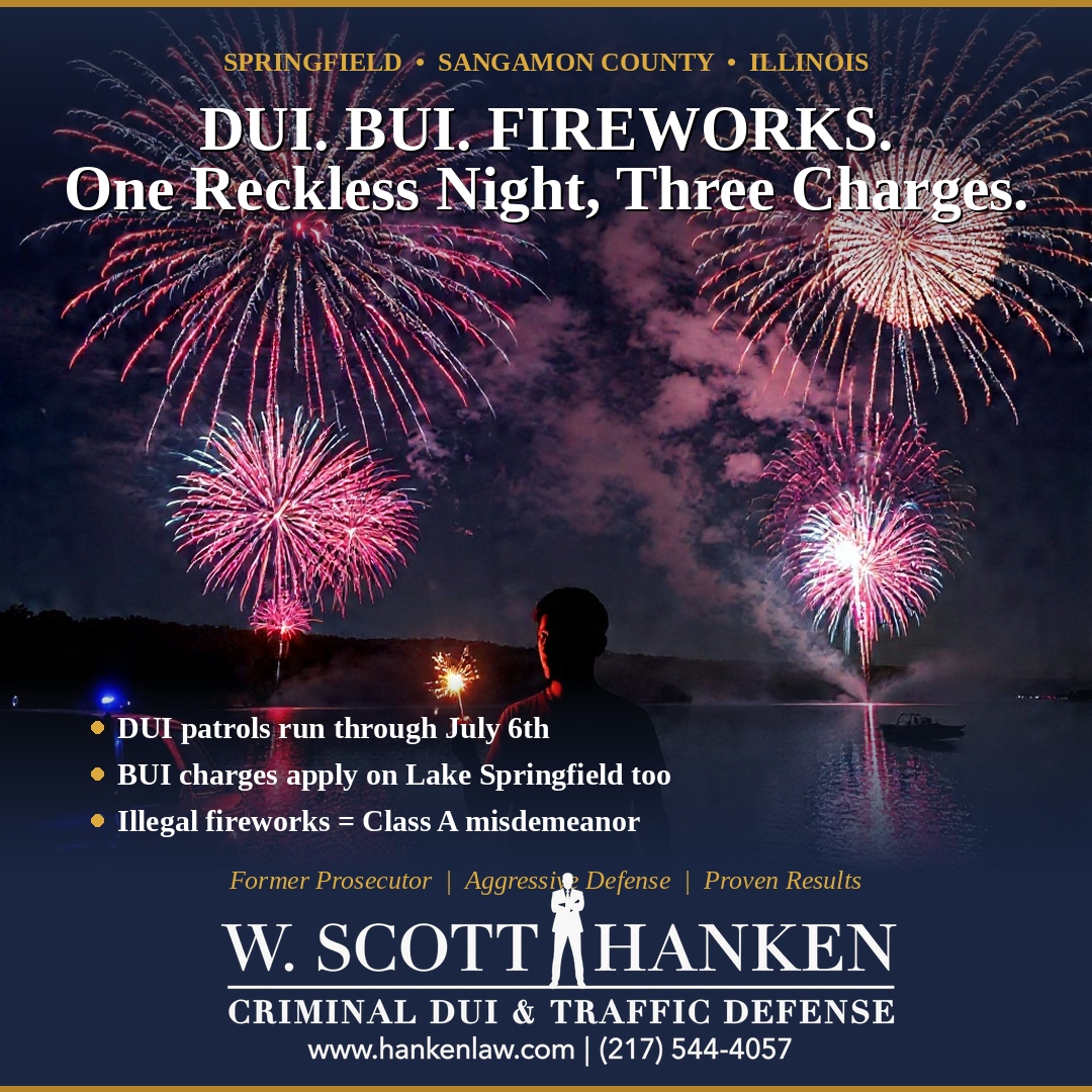 Fireworks illuminate the night sky over Lake Springfield beside the warning